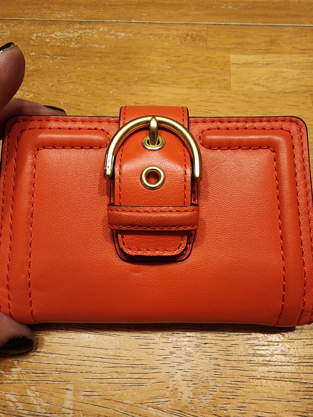 Coach Campbell Leather Buckle Medium Wallet in a vibrant orange shade with brass